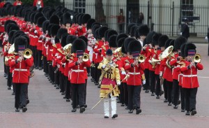 LONDON, ENGLAND - JUNE 15:  Guards march during the annual Trooping the Colour Ceremony on June 15, 2013 in London, England. Today's ceremony which marks the Queens official birthday will not be attended by Prince Philip the Duke of Edinburgh as he recuperates from abdominal surgery and will also be The Duchess of Cambridge's last public engagement before her baby is due to be born next month.  (Photo by Chris Jackson/Getty Images)